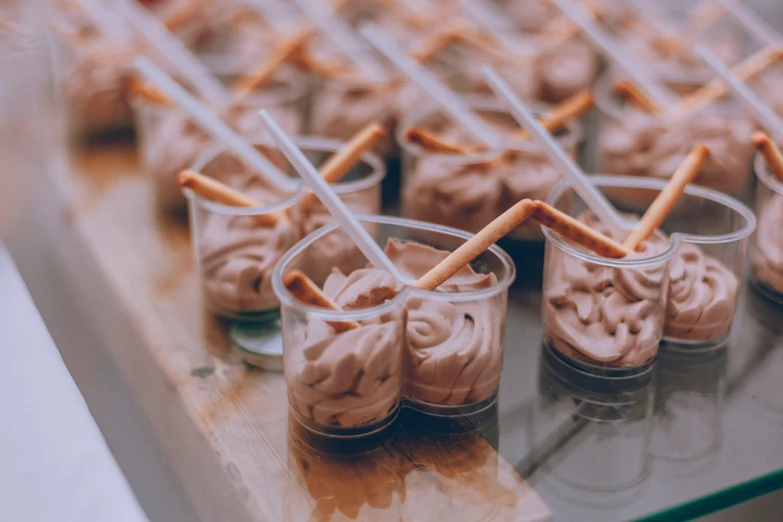 a display case full of food with chocolate toppings