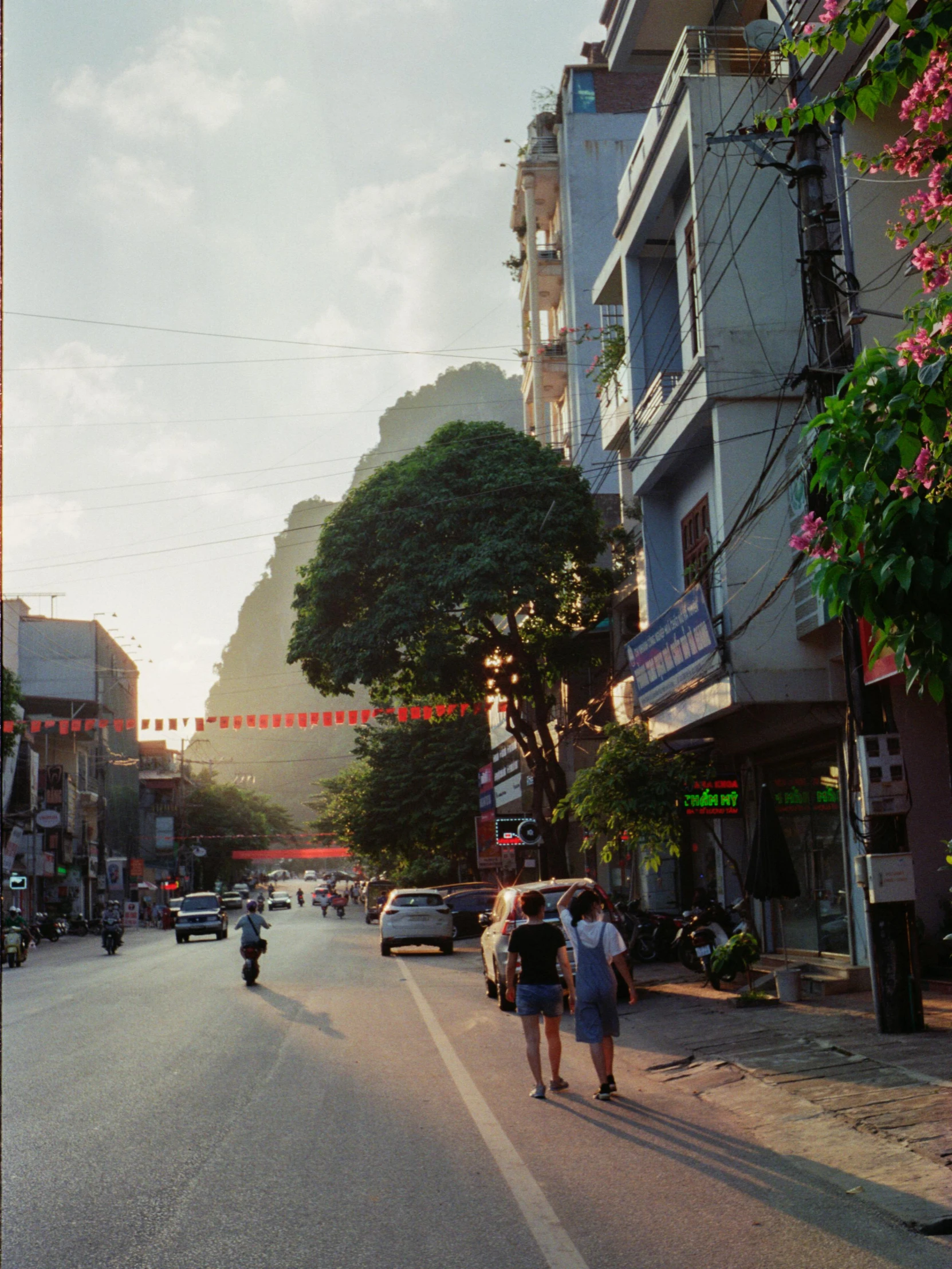 people walking on the street in an asian city