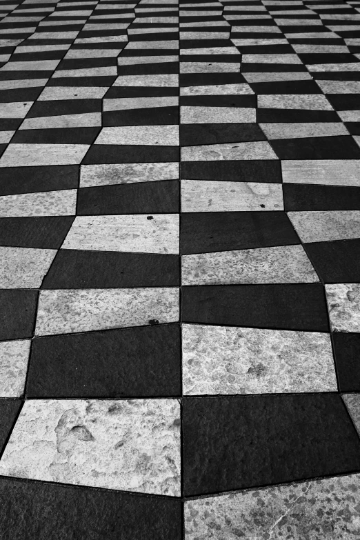 a black and white po shows a checkered pavement