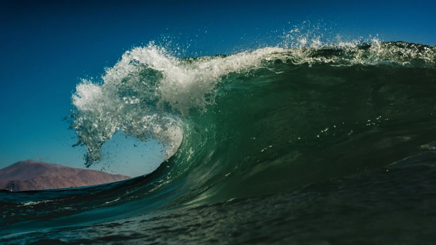 a very large wave that is breaking on top of it