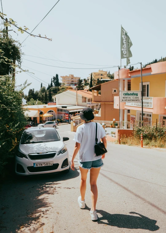 woman walking across street in a short skirt