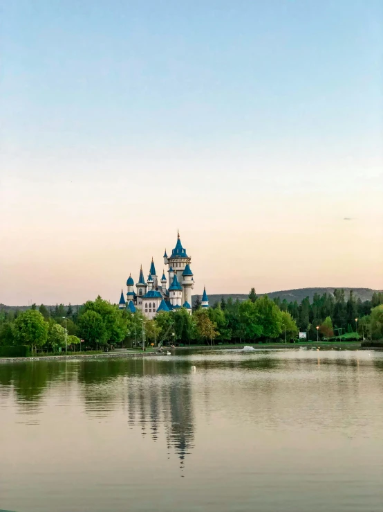 a scenic lake with a castle in the distance