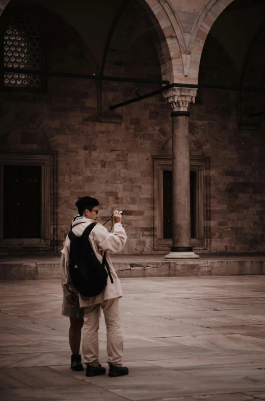 a man taking a po of himself while standing on the ground