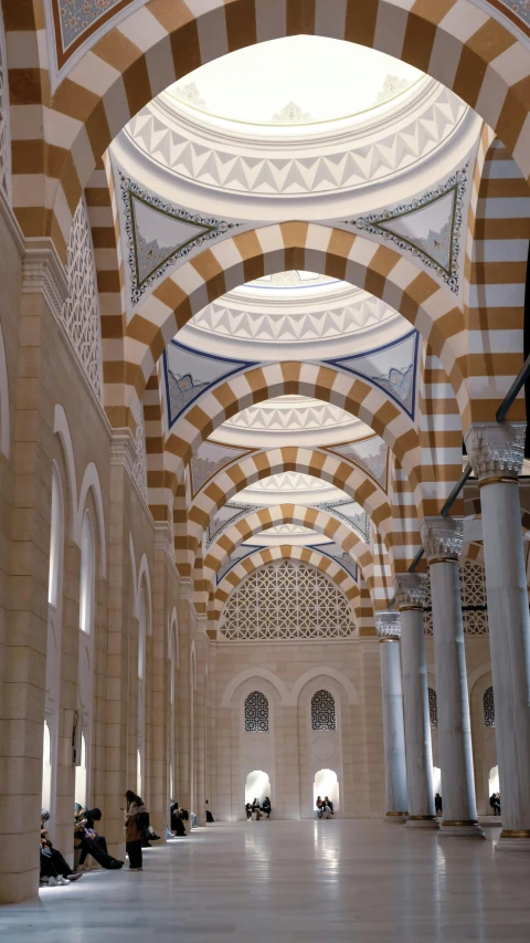 a large room with many columns and arches