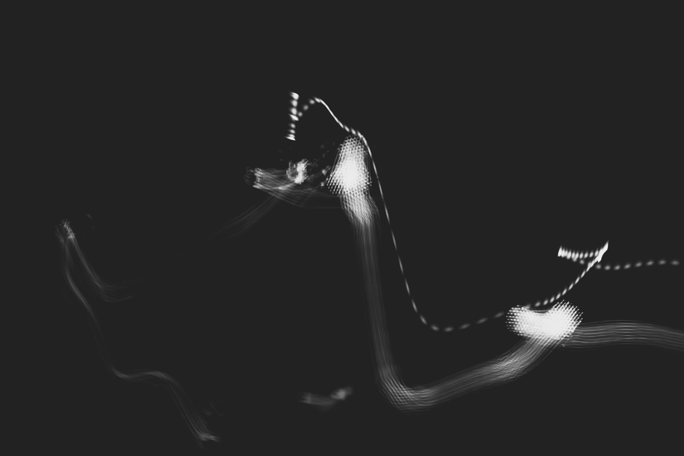 motion blur pograph of a wave in the dark