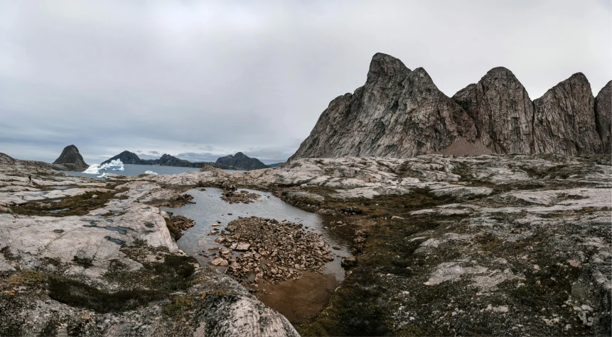 a very long stone walkway between two large rocks