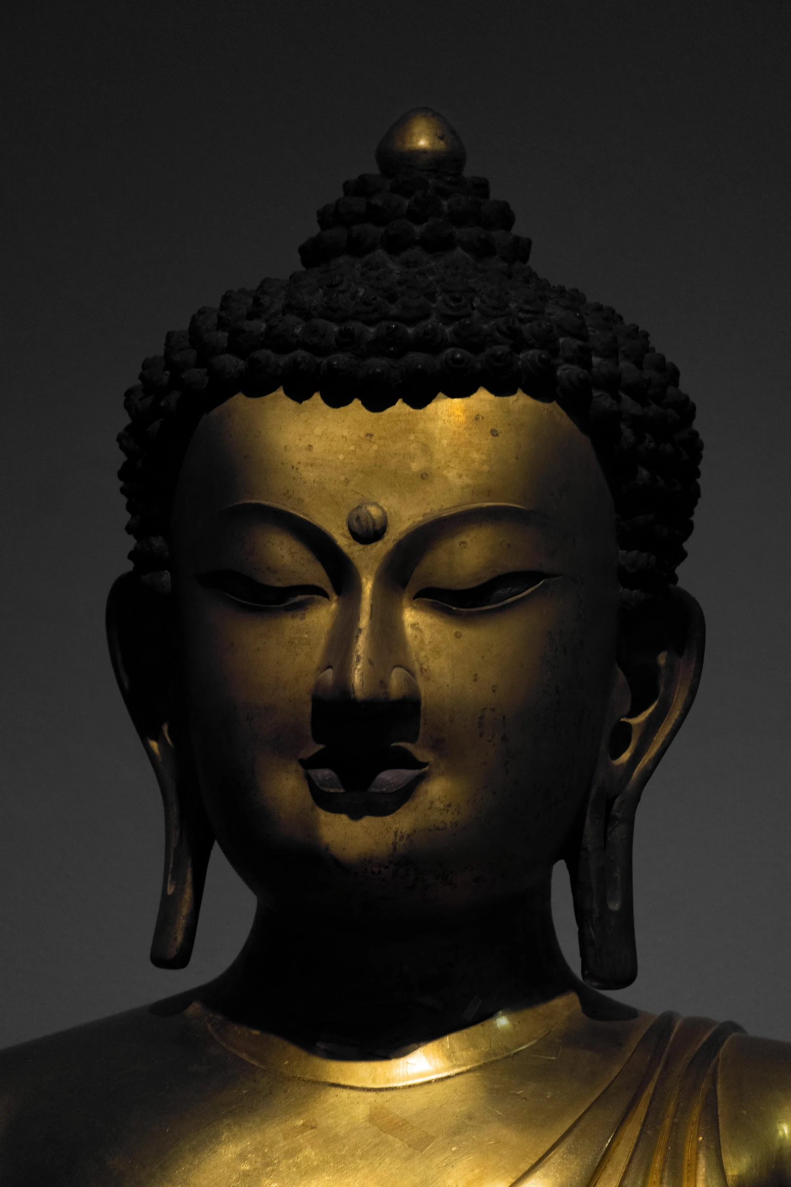 an image of a buddha statue with a black background
