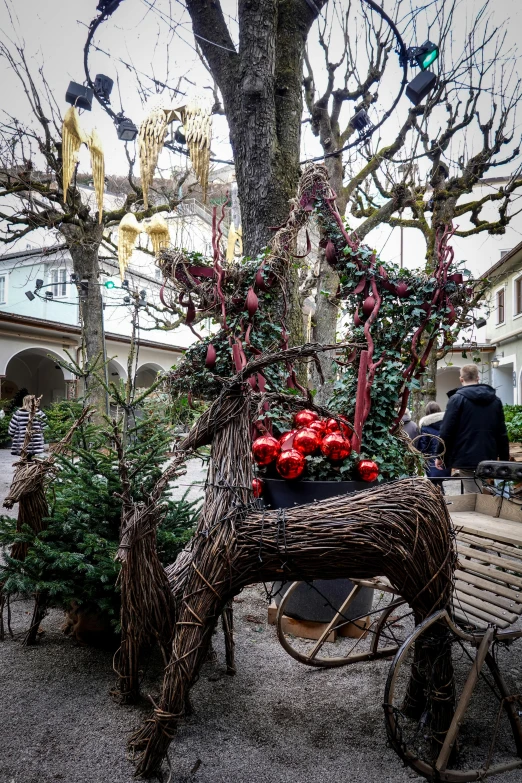 a man made tree and decoration at a christmas market