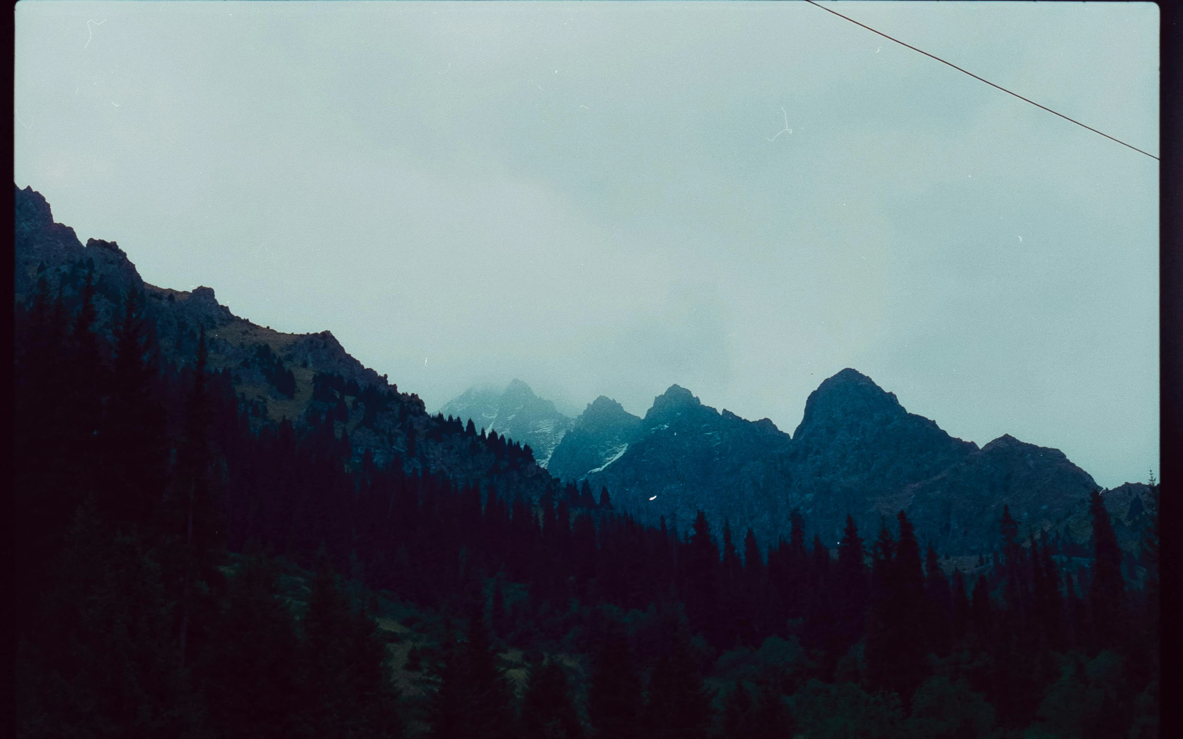 the view of some mountain peaks from below