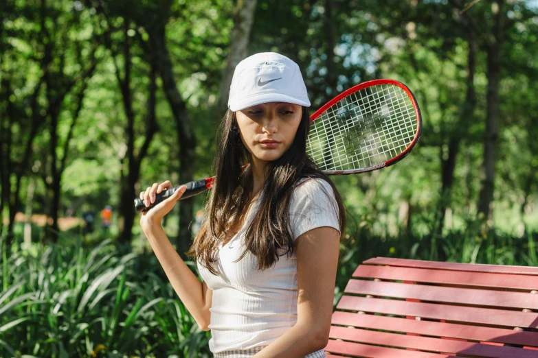 the girl is holding her tennis racket and posing for a po