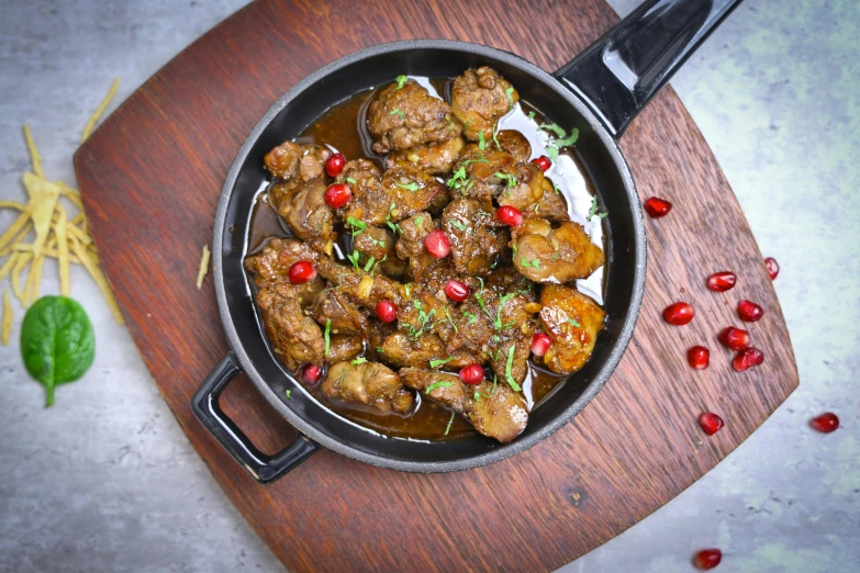 a pan filled with meat covered in spices