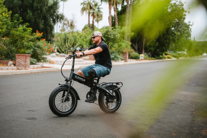 a man rides an old - fashioned bicycle in the street