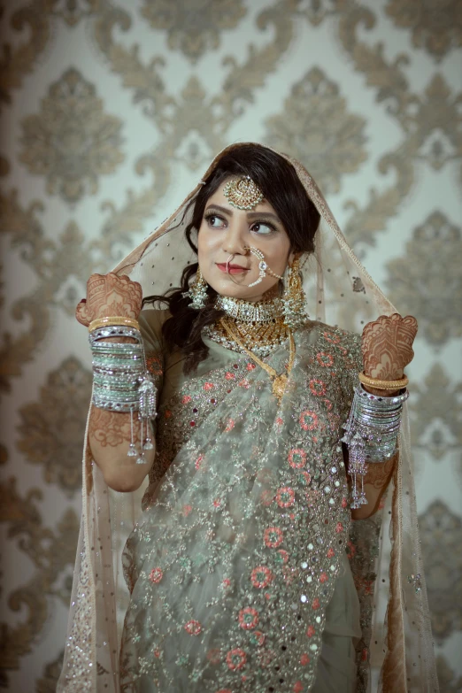 a woman dressed in traditional clothes poses for the camera