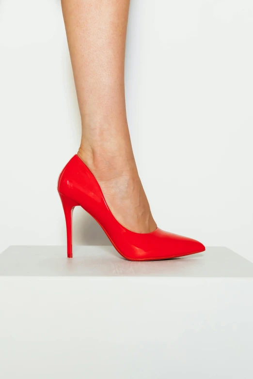 the legs of a woman in high heel shoes