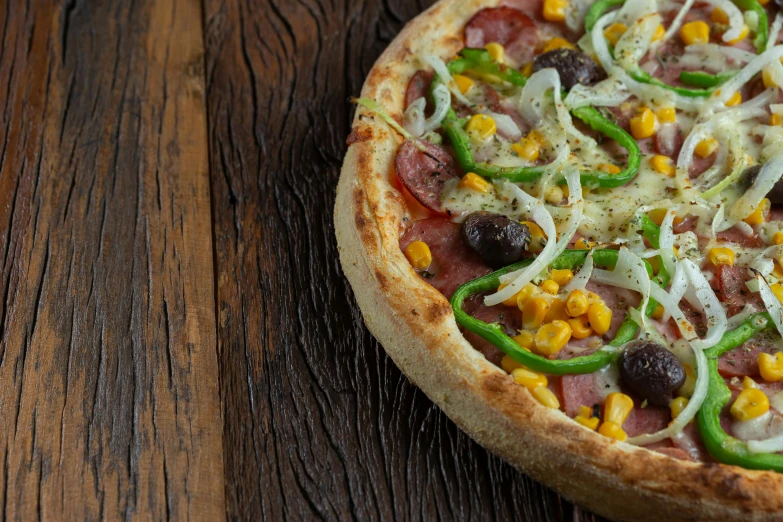 a close up of a pizza with various toppings on it