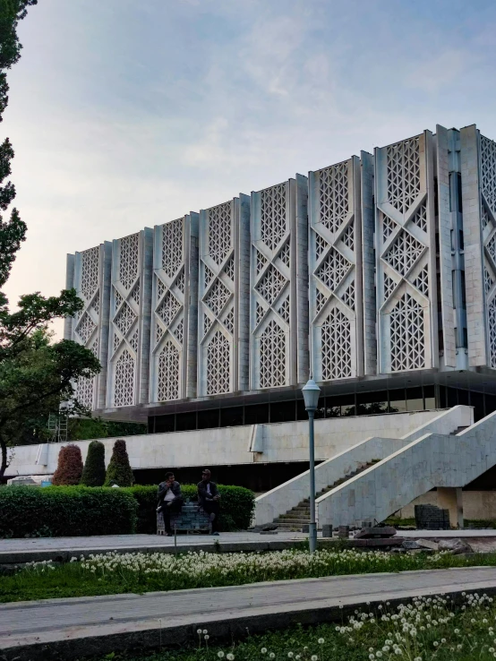 a large building on a street with steps leading to the top