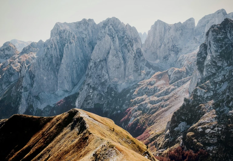 mountains covered in snow and a lone hiker