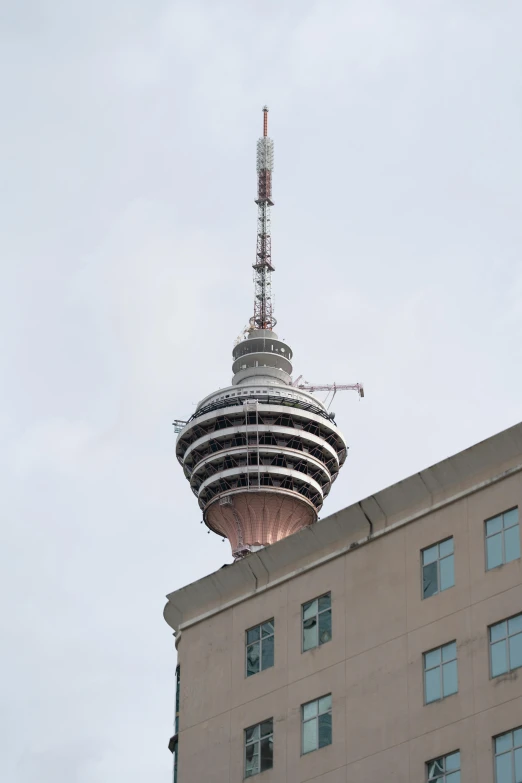 a large building and a very tall tower with a clock on top