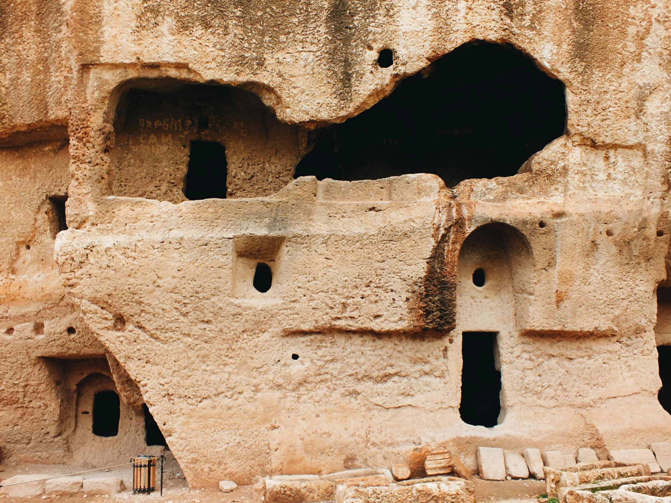 people are walking through the narrow cave like areas