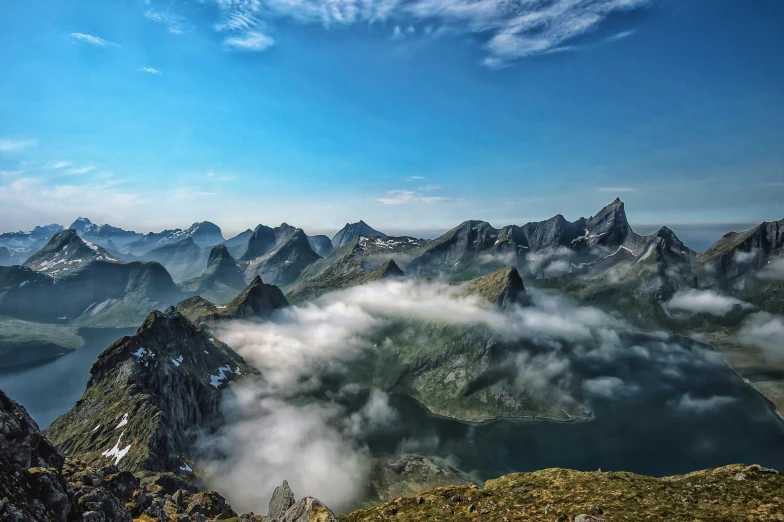 an aerial view of the mountains and lakes