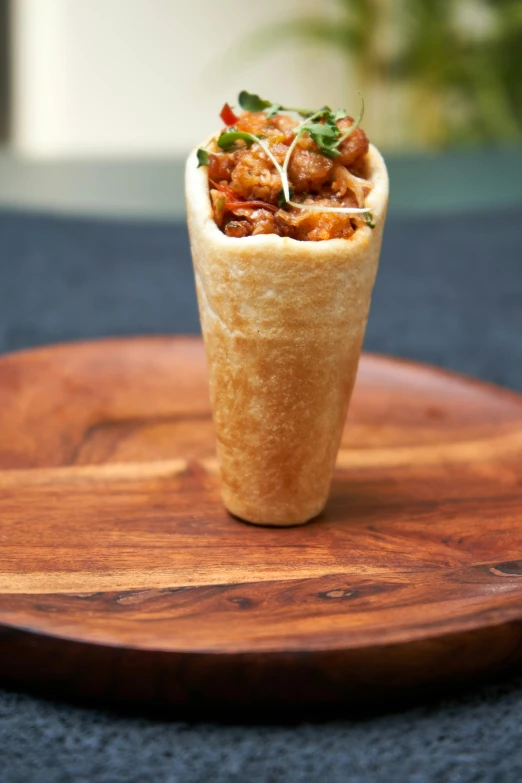 a wrap sitting on top of a wooden plate