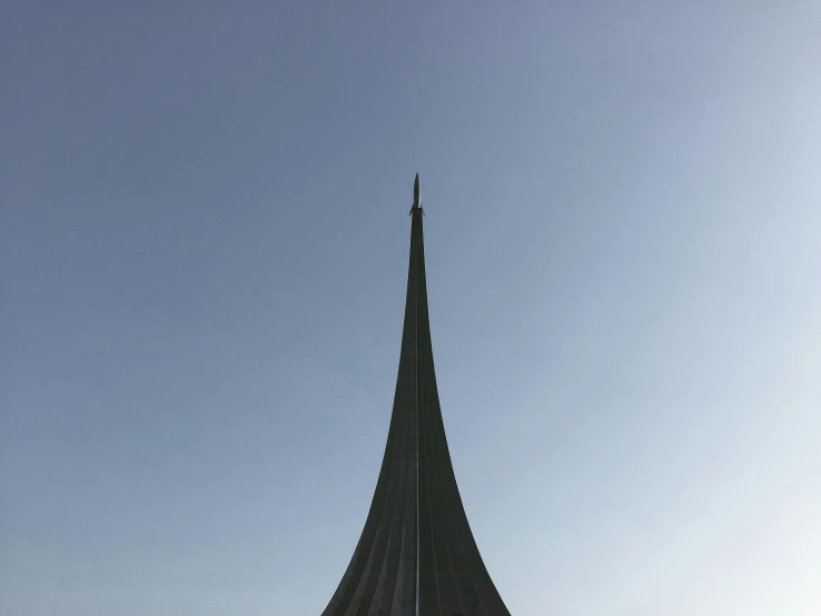 a very tall pyramid on the side of a building