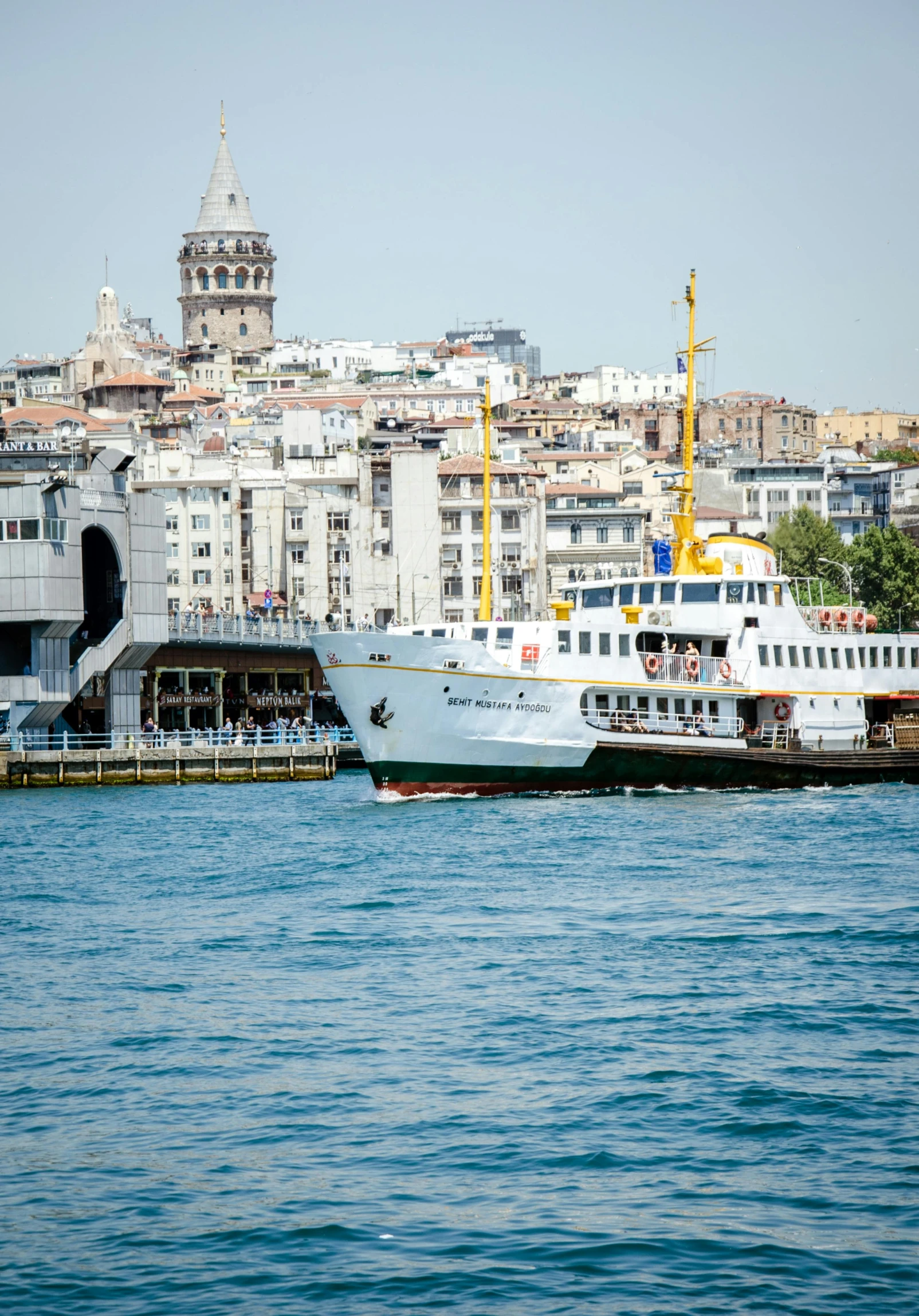 a cruise ship docked next to a city