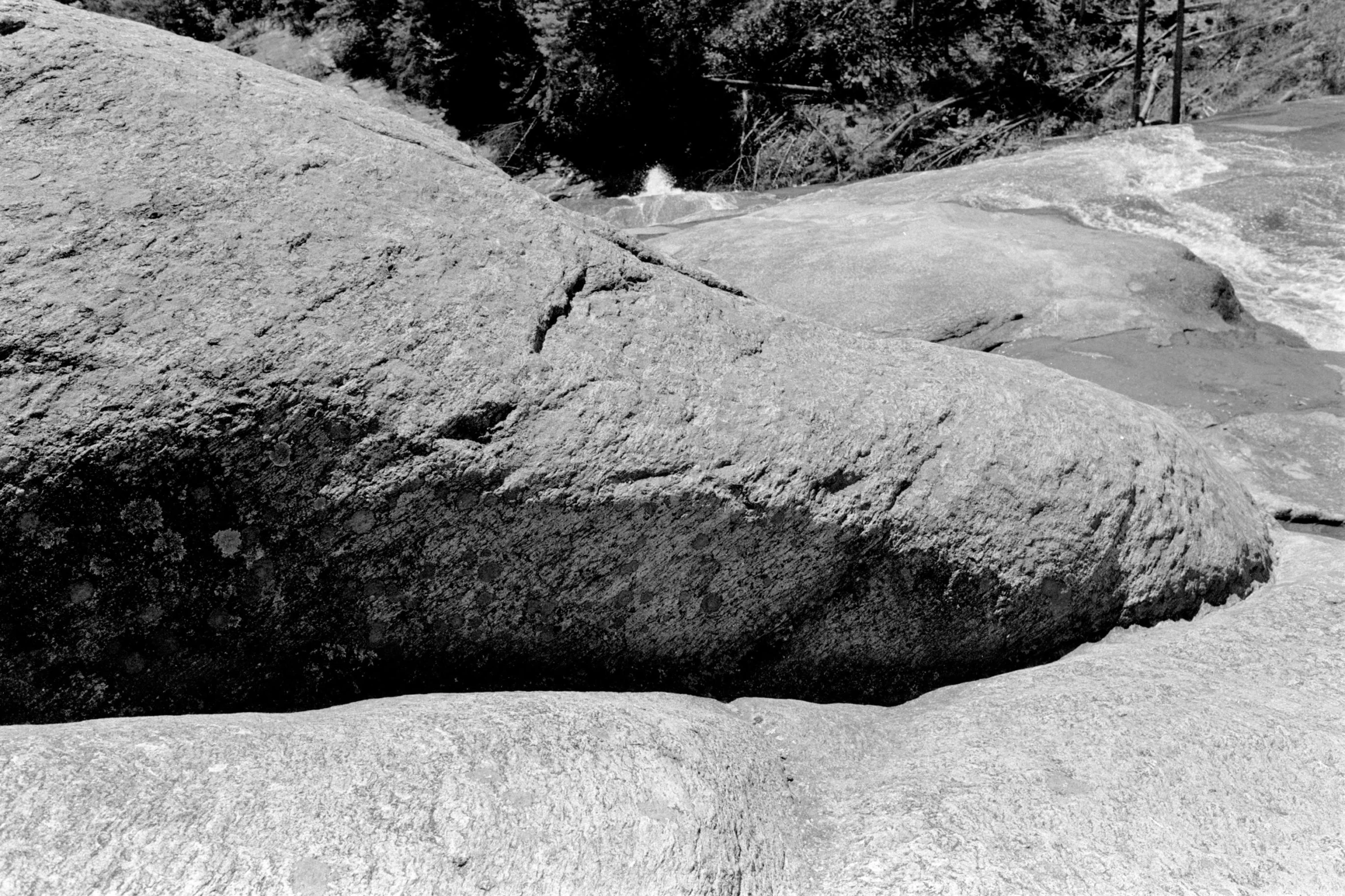 an image of a rock out in the sand