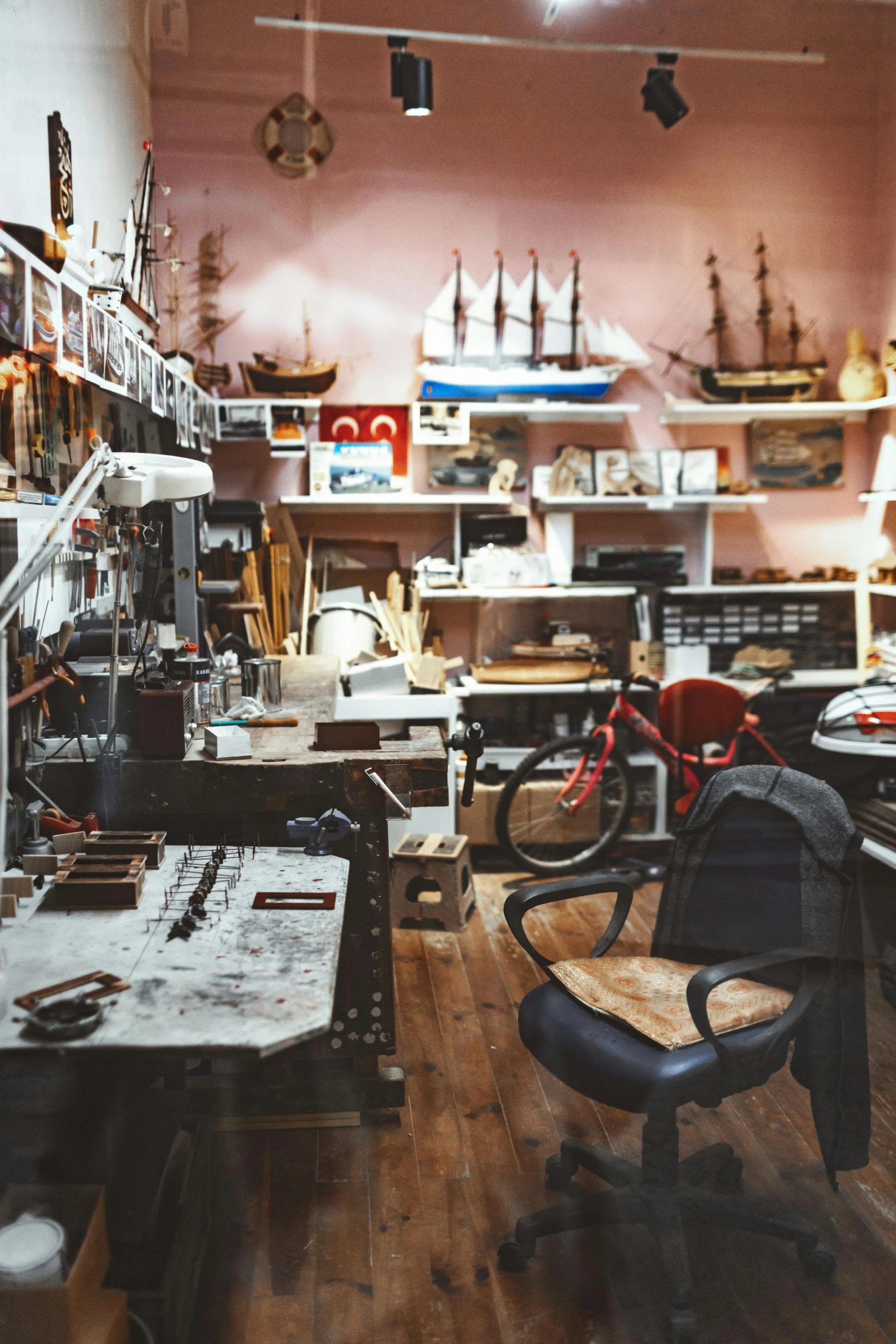 a room that has many items on the shelves