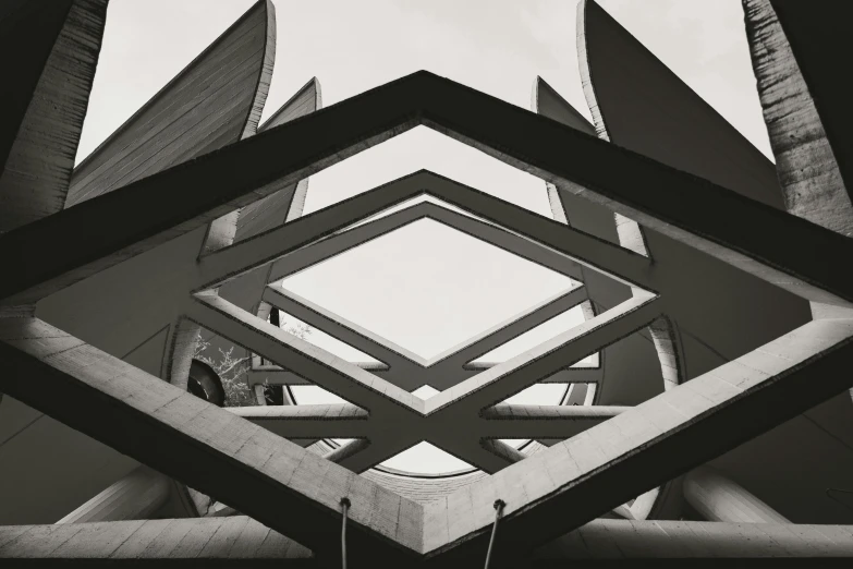 the front of an architectural structure looking up into the sky