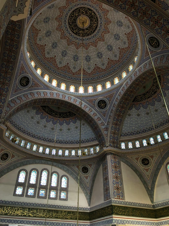 inside of an ornate building with a ceiling and arches