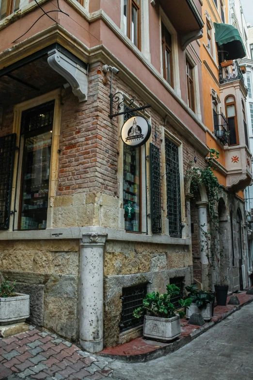 a brick building with a sign on the corner