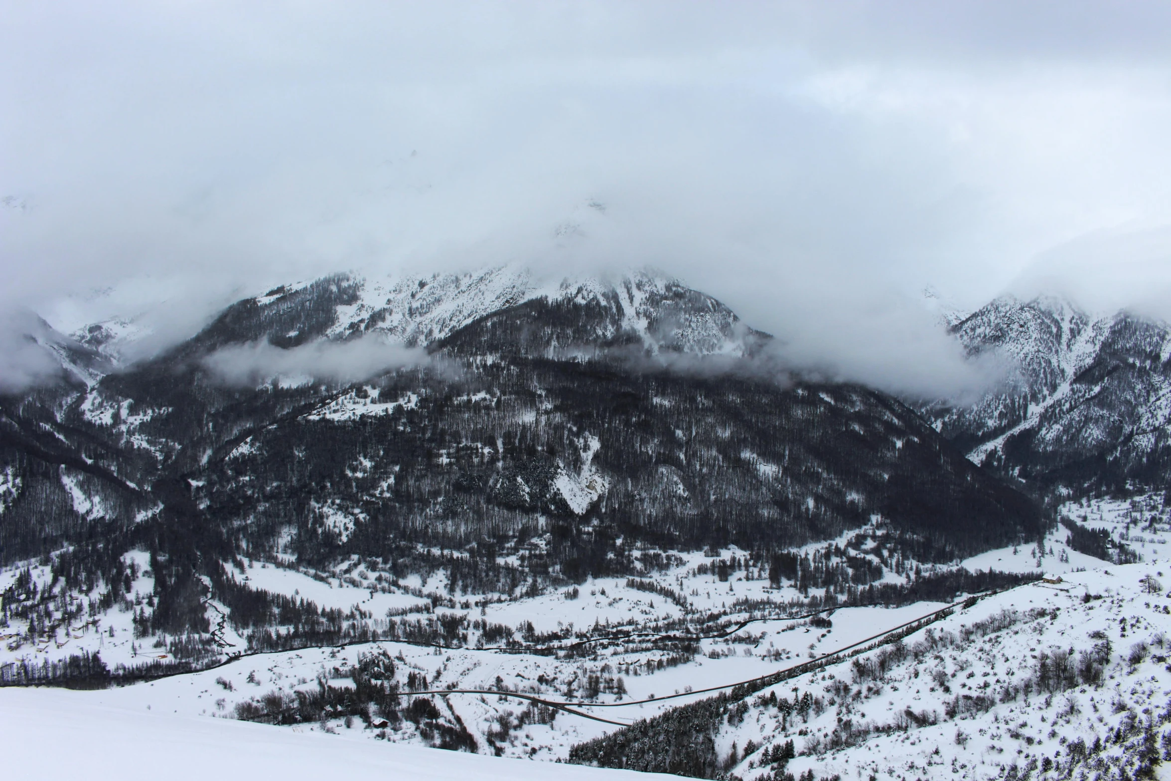 the mountains and valleys are covered in snow