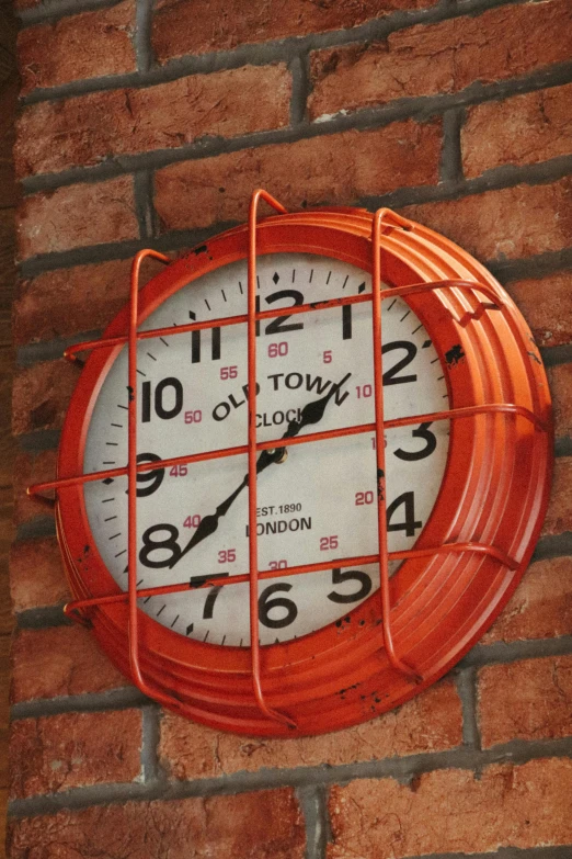 clock attached to brick wall with number four on it