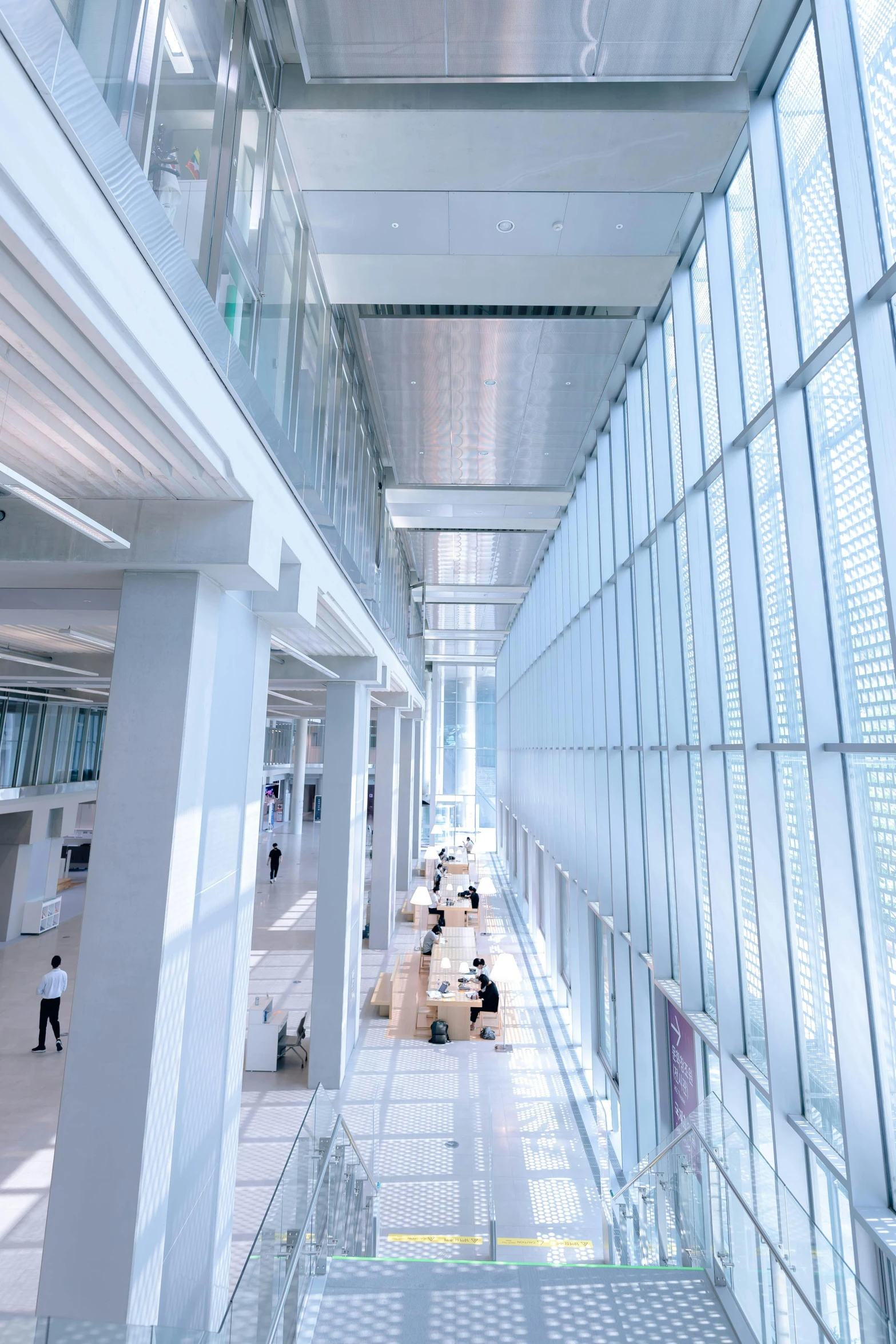 a large indoor area with many lights and some people