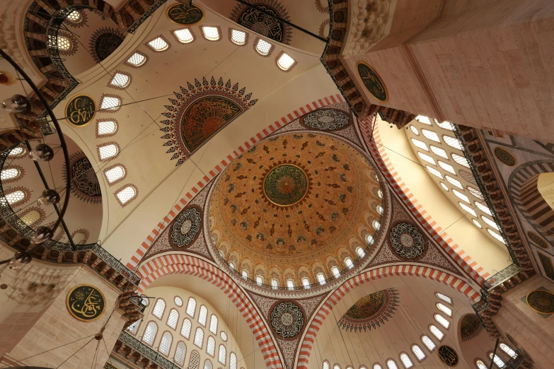 an interior of a building with several arches and domes