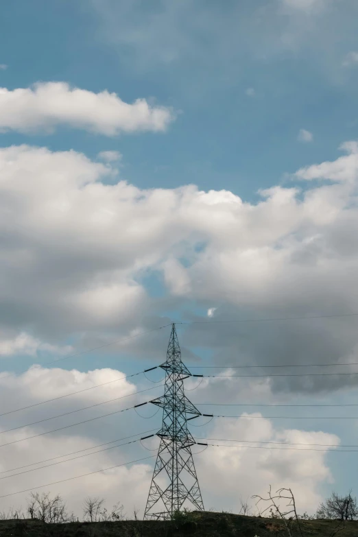 the view of an outback car and high voltage electric pole