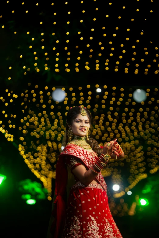 the woman in the red gown is wearing a garland