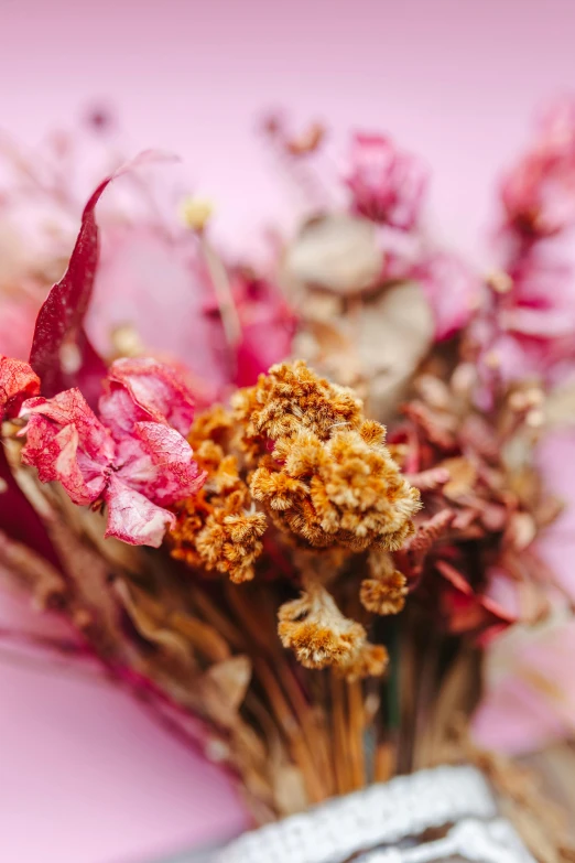 there is a bunch of different colored flowers in a vase