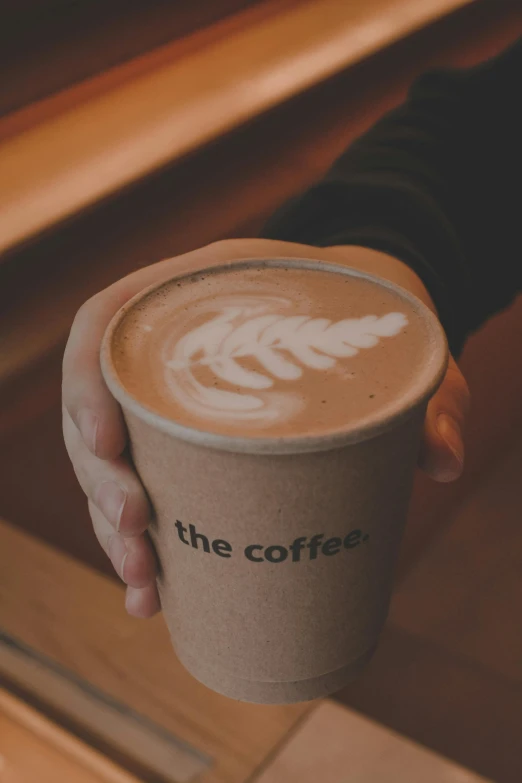 a cup of coffee with the word the coffee written on it