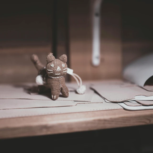 a mouse with a cute little toy standing on top of it