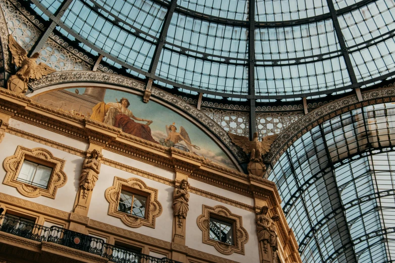 an ornate building with several painted ceiling panels