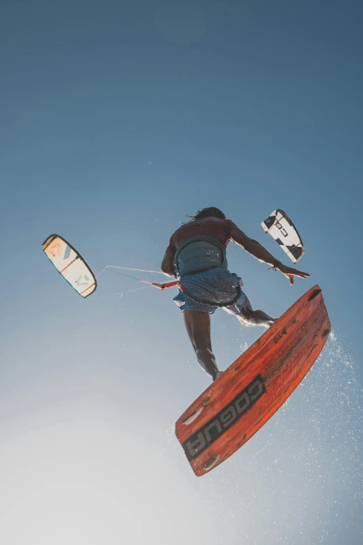 a man doing tricks on a red board