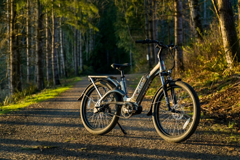 a bike that is on the side of a dirt road