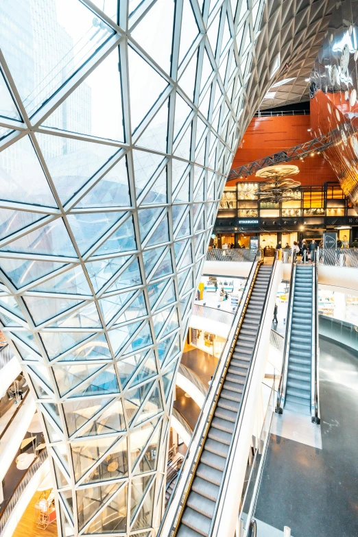 an escalator inside a very large modern building