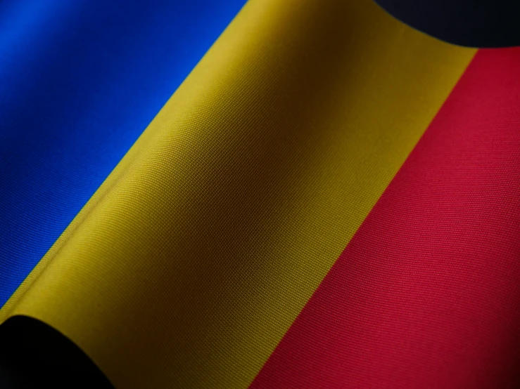 a flag with the colors of germany and blue, yellow and red