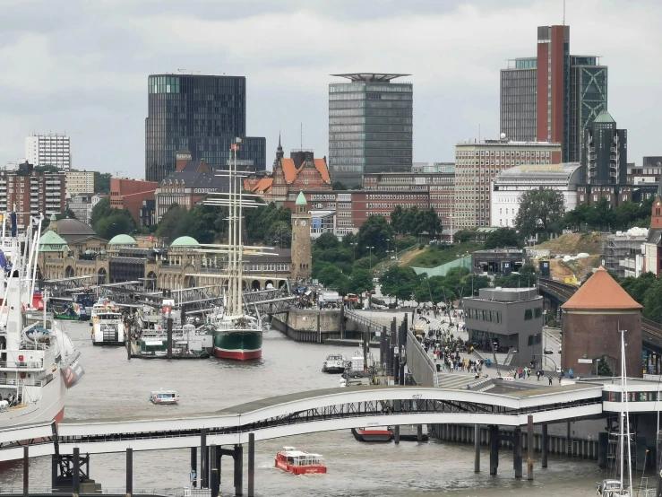 the boats are at their docks in the bay and under city buildings