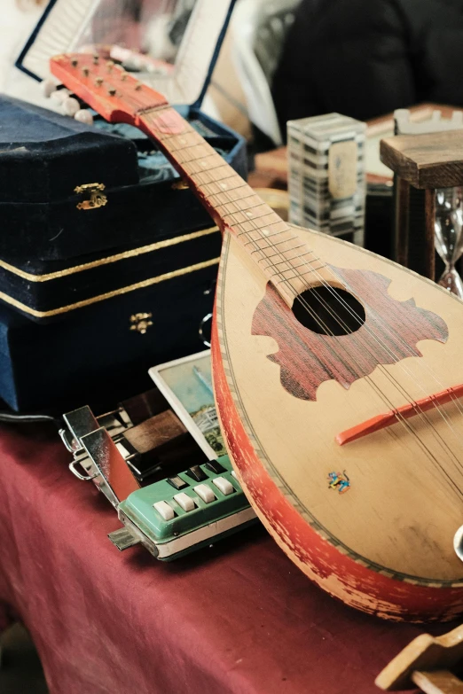 a small guitar sitting on top of a table