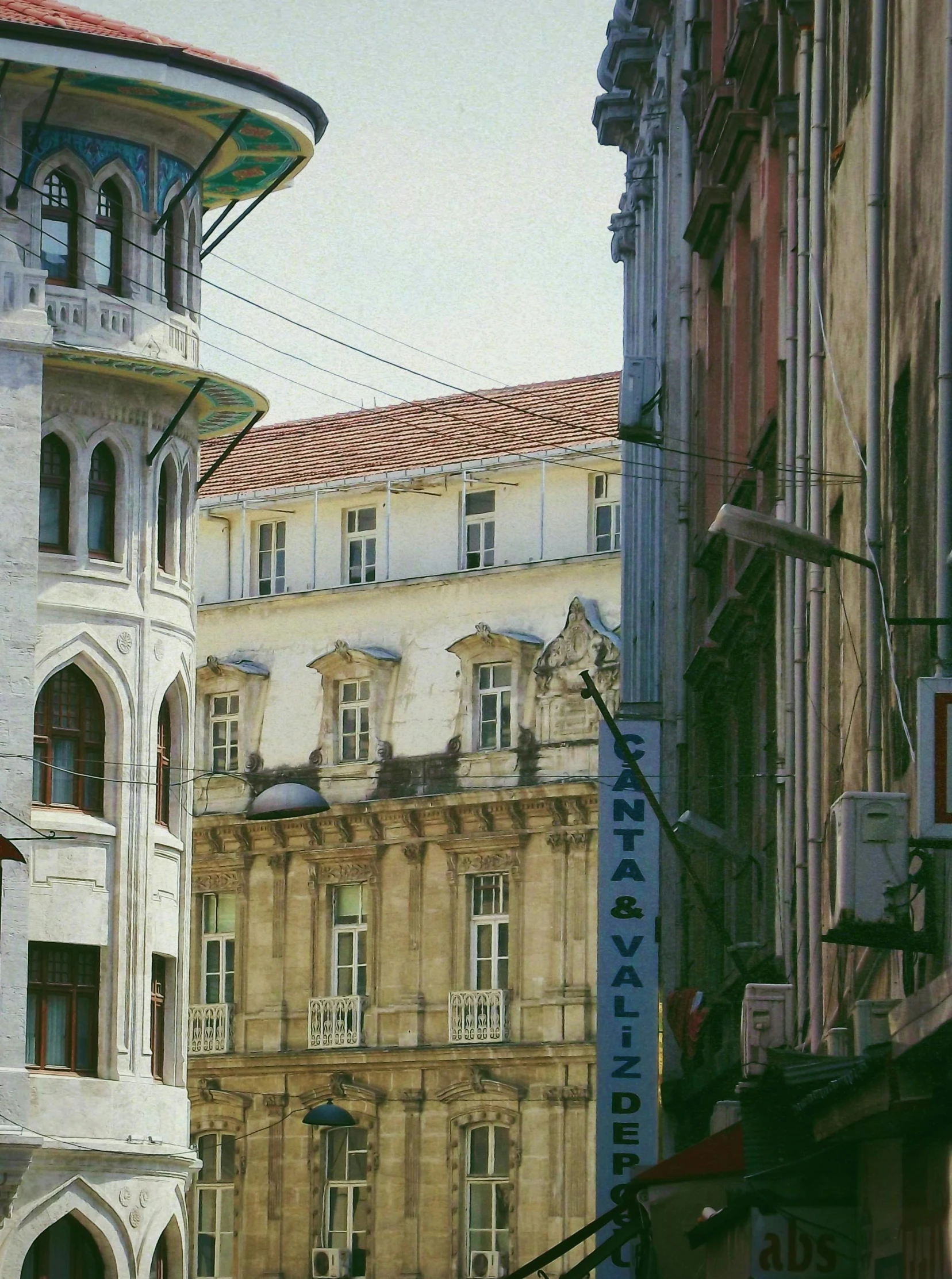 buildings and street lamps stand next to each other