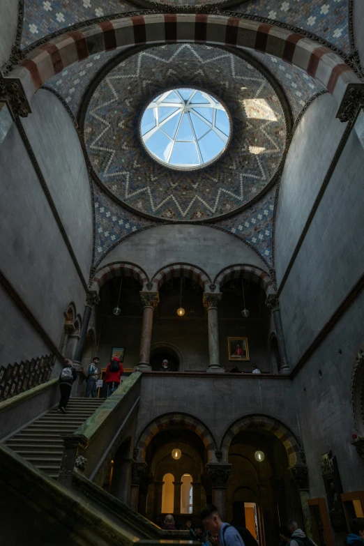 the ceiling of a building with some stone steps and a dome